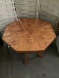 Antique quilted maple coffee table with star wood inlay. Approx 32x32x29 inches.
