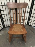 Antique Americana wicker seat rocking chair with 