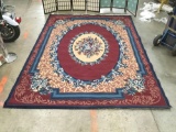 Beaulieu Rugs 100% olefin pile area rug w/ floral designs & worn fringe, shows wear