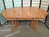 Modern mission style oak dining table in octagon shape with 1 leaf and pull our drawer