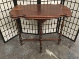 Vintage mahogany crossed base end table with burled and scalloped top