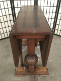 Vintage drop leaf trestle base dining table with burnished top design