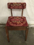 Vintage chair w/ storage under upholstered seat.