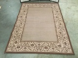 Earth tone rug w/ floral designs, approx. 90x63 inches.