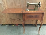 Vintage Westinghouse New Home sewing machine table model no. 955901-E. Approx 31x22x17 inches.