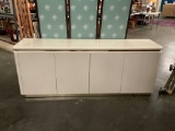 Art deco style white and gold buffet cabinet w/ sleek design. Approx 75x30x18 inches.