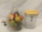 Glass pear jar filled with ornamental fruit, & plastic wood top fruit themed container