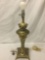Vintage metal base table lamp with ornate accenting.