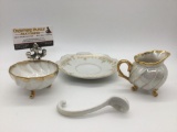 4 Japanese China items: saucer w/ gold tone trim, soup spoon, & opalescent creamer & sugar bowl.