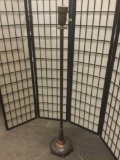 Metal floor lamp with ornate base. Tested & working