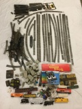 Collection of HO scale model train tracks, train cars, MRC Model Train Controller and accessories