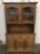 Modern oak 2 pc hutch cabinet with leaded glass door top and slight floral design