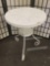 Vintage white metal round patio / cafe table, approximately 26x20x20 inches.