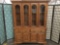 Large two-piece curio cabinet w/ 3-shelves, 2-drawers, & interior lights