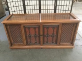 Vintage Magnavox stereo cabinet. Some wear/water ring on top surface, see pics. Approx. 63x21x30 in.