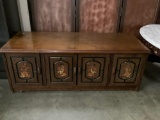 Vintage cabinet featuring bird and floral designs. Approx 42x16x15 inches.