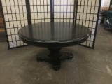 Round black coffee table, approx. 38 x 20 inches.