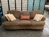 Thomasville corduroy and paisley pattern sofa with throw pillows. Approx 88x43x34 inches.
