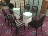 Modern table w/ composite pillar bases, glass top, & 6 chairs w/carved duck motif approx 72x36x30 in