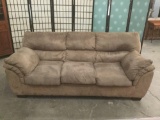 Modern brown couch, approximately 81 x 36 x 36 inches.