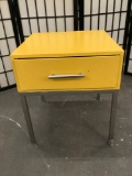 Steel leg wooden end table w/ one drawer, painted yellow