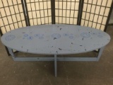 Vintage coffee table, painted blue. Approx. 55x26x18 inches. Sold as is.