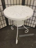 Vintage white metal round patio / cafe table, approximately 26x20x20 inches.