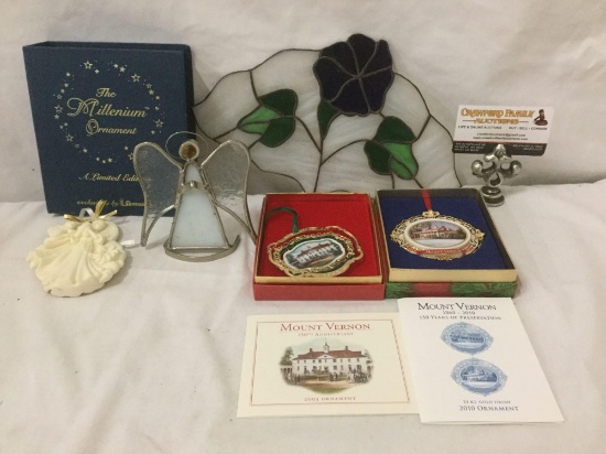 Lot of ornaments and stained glass home decor.