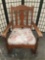 Vintage wood rocking chair with floral upholstered seat cushion