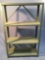 4-tier metal shelf, shows wear from use, approx. 30 x 11 x 48 inches.