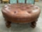 Large Marge Carson round wood island couch / seat w/ vinyl upholstery, Approx 48 x 20 inches.