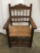 Vintage wood carved arm chair w/woven seat