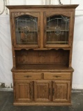 Modern oak 2 pc hutch cabinet with leaded glass door top and slight floral design