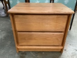 Modern pine wood two drawer end table, shows wear, approx. 25 x 18 x 22 in.