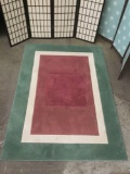 American Rug Craftsmen Inc. area rug, tri-color, fraying on edges.