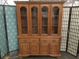 Large two-piece curio cabinet w/ 3-shelves, 2-drawers, & interior lights