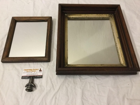 2 Vintage wood frame mirrors, largest approximately 16 by 14 inches.