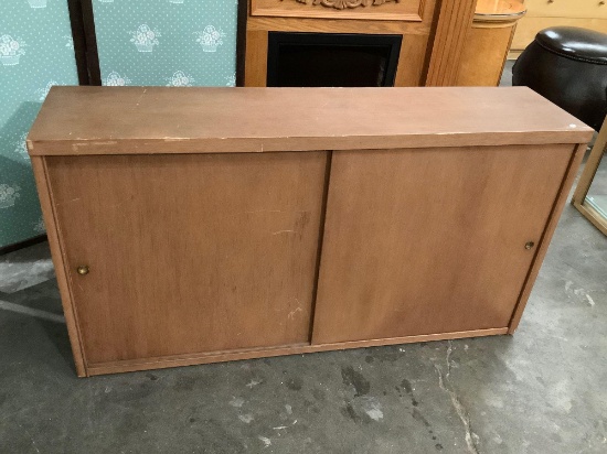 Vintage wood bookshelf with sliding wood doors, approximately 11.5 x 47 x 25.5 in.