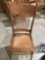 Vintage wood carved chair w/ leather seat, approximately 18 x 19 x 40 in.