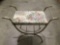 Vintage metal frame vanity seat with floral upholstery , approx 26 x 12 x 21 in.