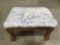 Wooden footstool with patriotic fabric upholstery , approximately 16 x 12 x 9in.