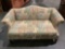 Modern love seat w/ multicolor pastel floral upholstery, approx 32 x 31 x 63 in.