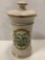 Vintage gold rim ceramic SANICULA kitchen jar with lid, approximately 6 x 12 in.