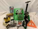 Crate full of flashlights, lamps, bicycle pump, and more, see pics. Sold as is.