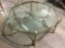 Glass top coffee table with brass base, cloven foot design, nice condition