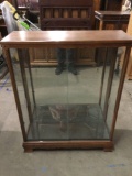 Vintage wood sliding glass door display case w/ 3 glass shelves, missing brackets. Sold as is.