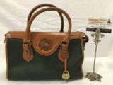 Dooney and Bourke leather ladies handbag, made in USA, approx 12 x 6 x 8 in. Shows wear.