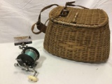 2 pc. lot of vintage PENN fishing reel and woven fish basket.