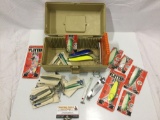 Adventurer Bass Tamer Tackle box full of fishing gear: lures, jigs, hooks, some in packages