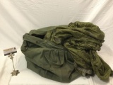 Vintage 1967 green canvas duffel bag w/ nylon hunting blind.